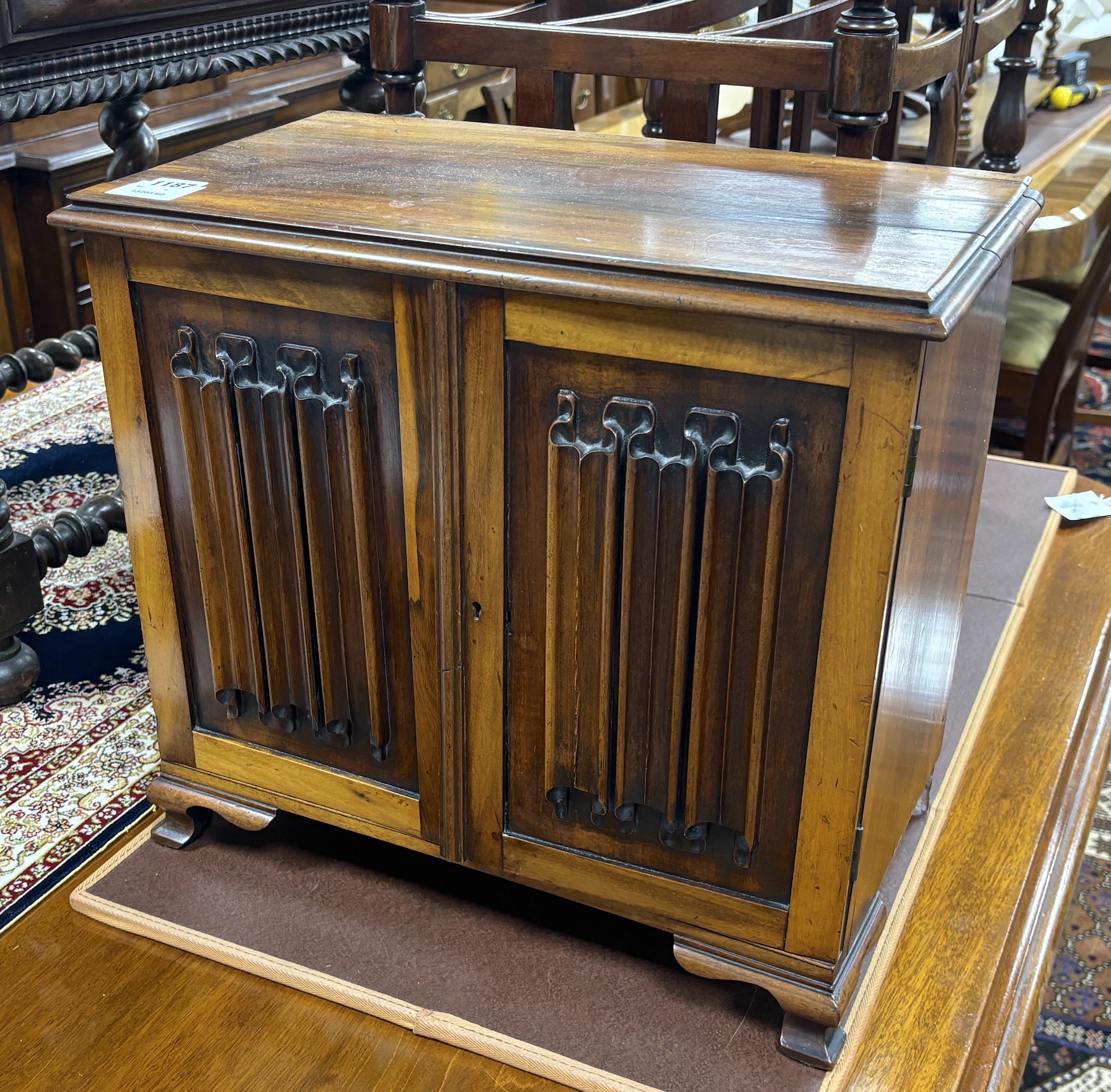 A Goncalo Alves linenfold panelled table cabinet, c.1900, width 45cm, depth 25cm, height 41cm